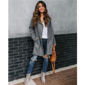 Gray coat. Never worn.Ordered online was to big